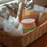 A basket contain pop up foil, baking paper,cling flim,cupcake liners